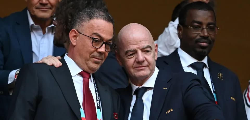 FIFA officials discussing during event in stands