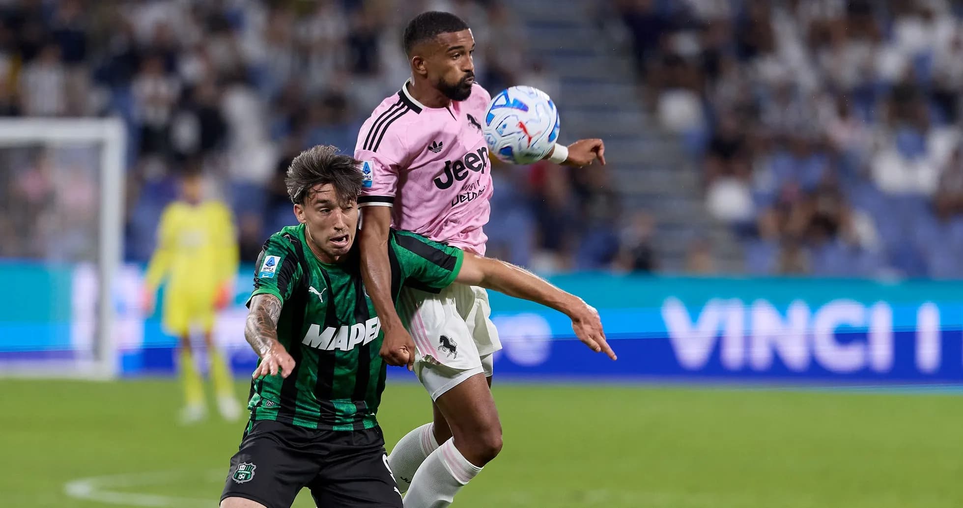 Player from Juventus in pink jersey contests ball