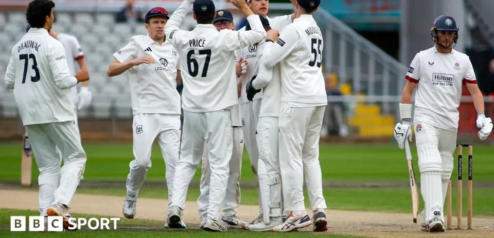 Cricket team celebrating a wicket on the field