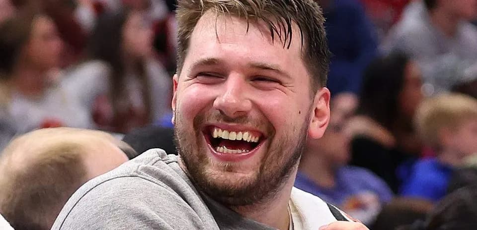 Player laughing on the sidelines during game