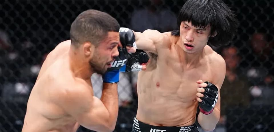 Fighter delivering a punch during UFC match