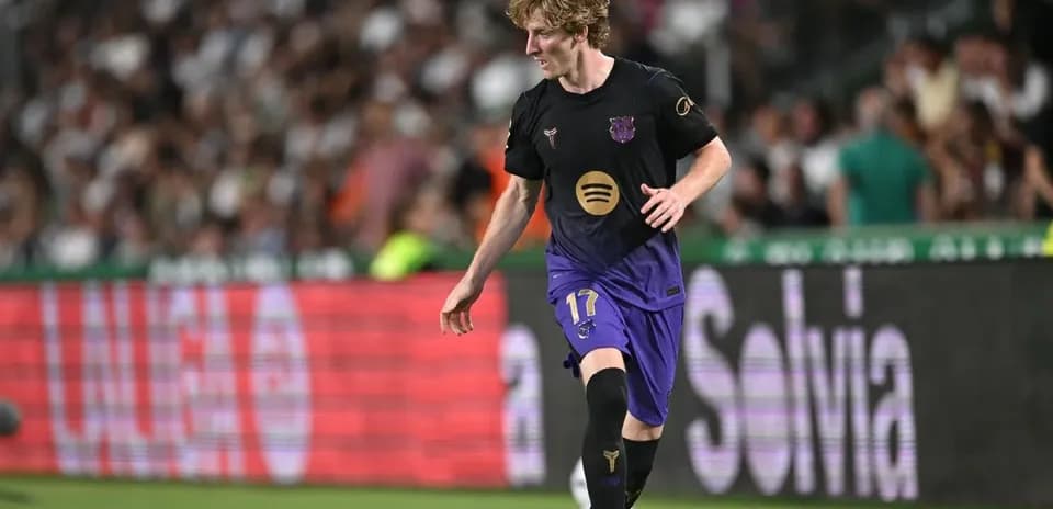 Player in Barcelona kit dribbling during a match