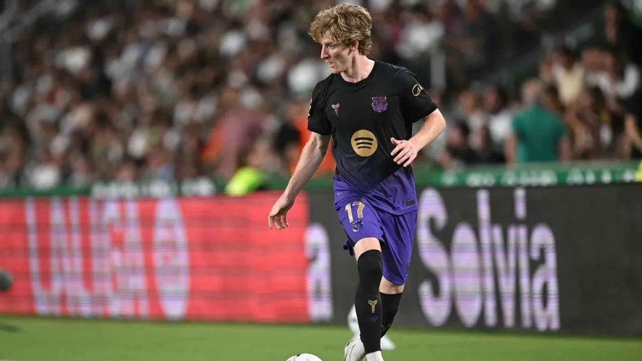 Player in Barcelona kit dribbling during a match
