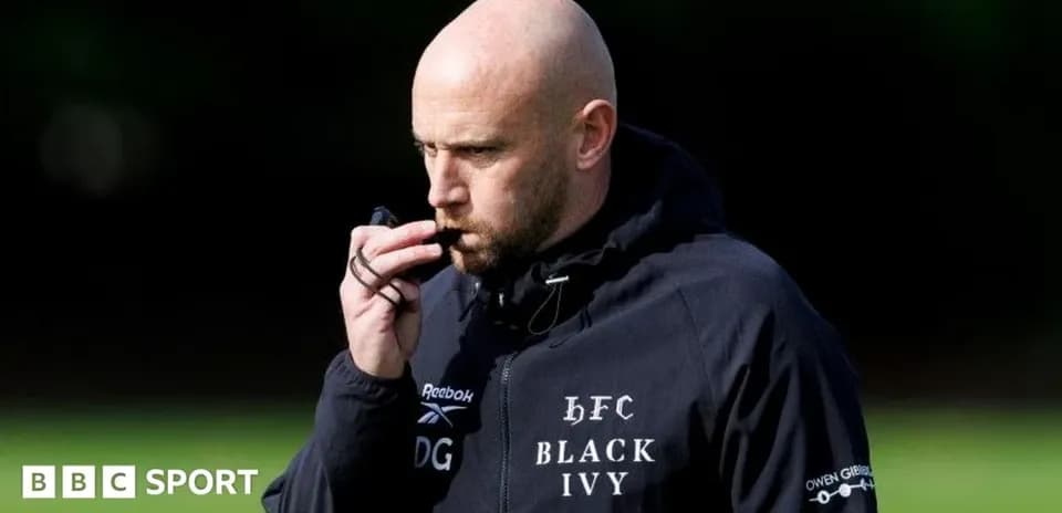 Coach using a whistle during training session