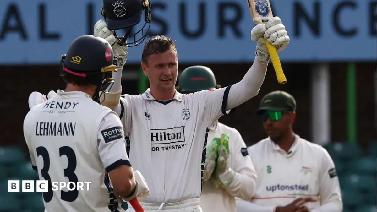 Batsman celebrating a milestone with teammates during match