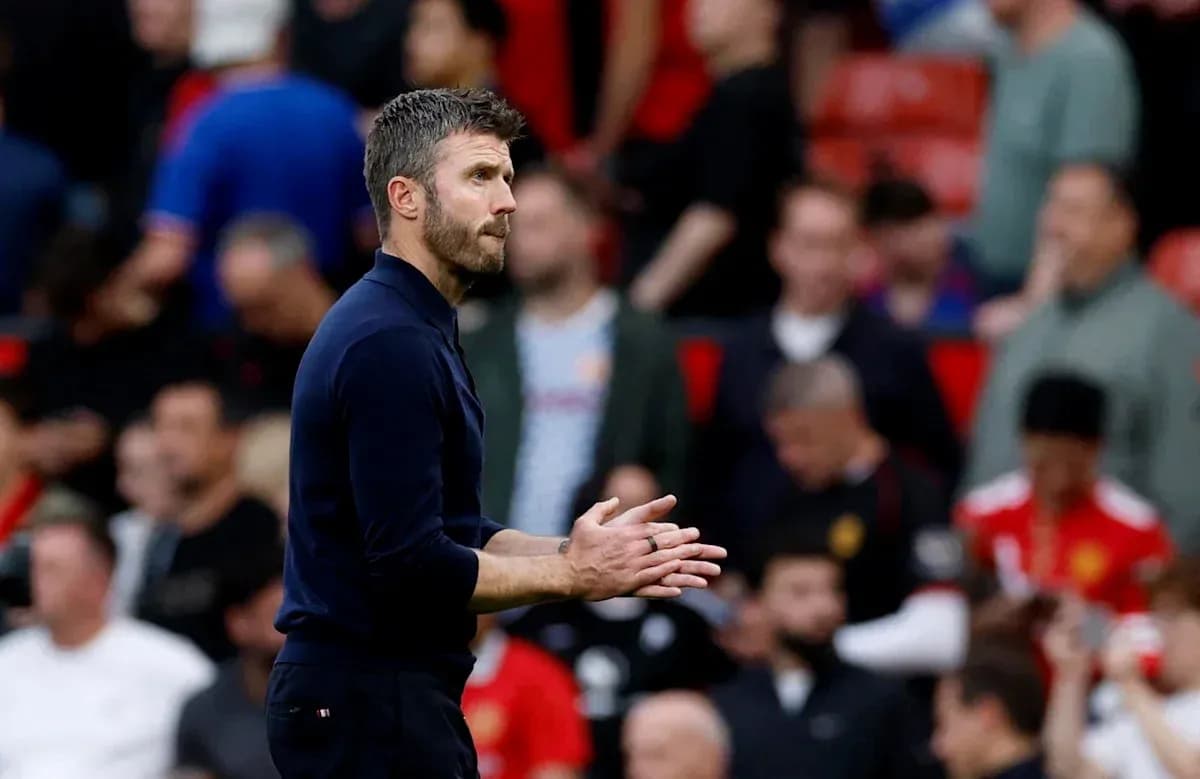 Coach clapping during match at stadium