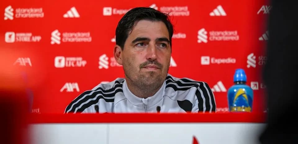 Manager at press conference with backdrop branding