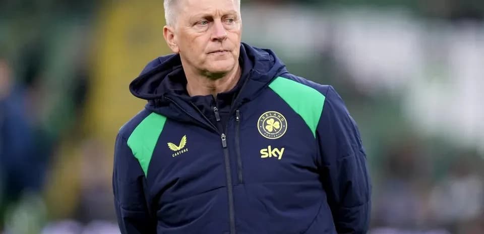 Coach observing players during training session