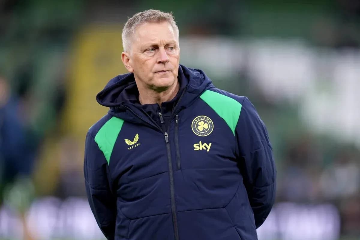 Coach observing players during training session