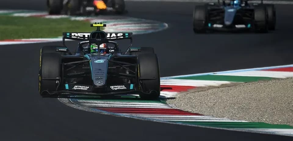 Mercedes car navigating a turn during a race