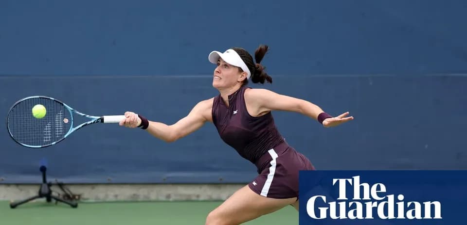Female tennis player returning a serve on court