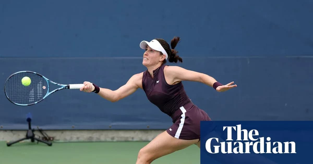 Female tennis player returning a serve on court