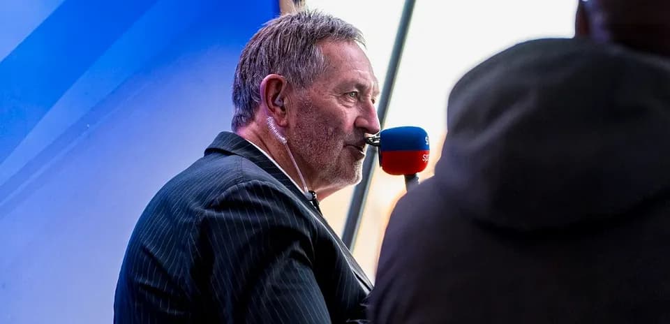 Commentator speaking into microphone during broadcast