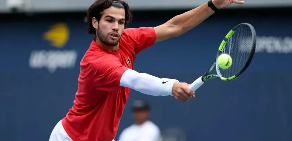 Tennis player hitting a forehand during practice