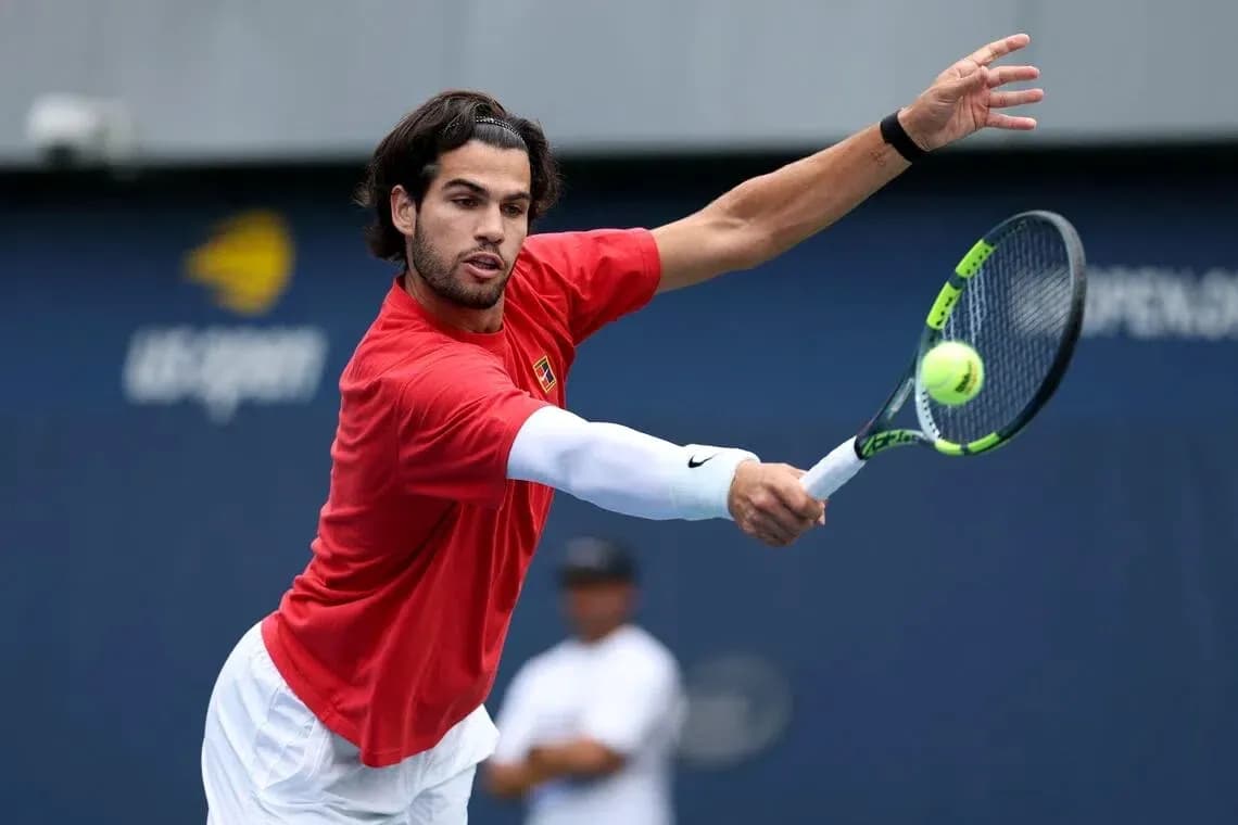 Tennis player hitting a forehand during practice