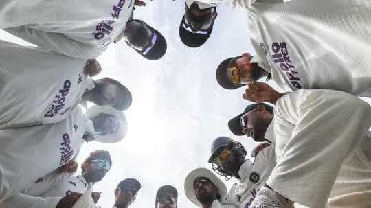 Cricket team in a huddle before the match