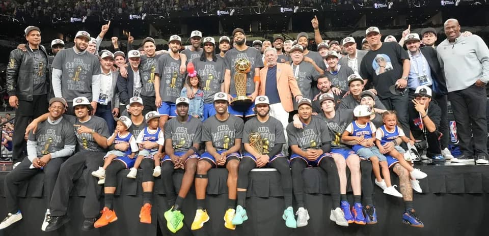 New York Knicks celebrating NBA championship victory with trophy