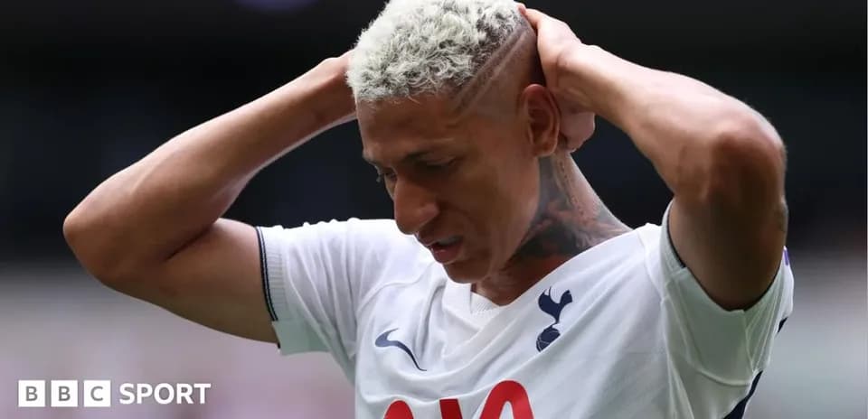 Tottenham player with hands on head during match