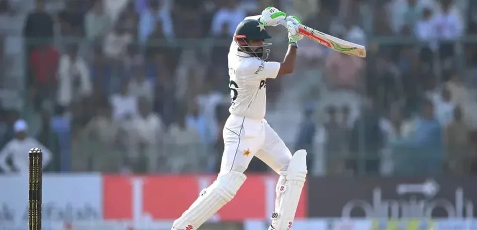 Batsman playing a shot during cricket match