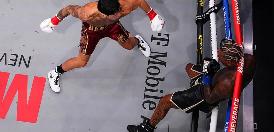Boxer delivering a punch in the ring