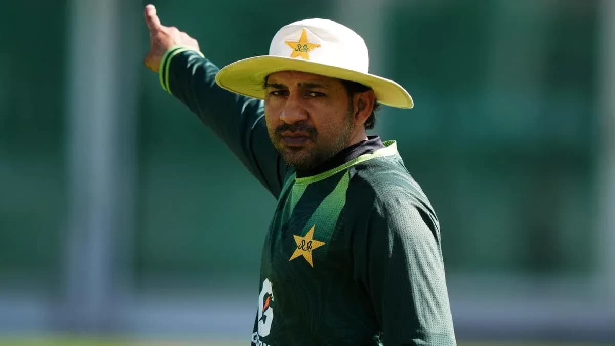 Cricketer gesturing during training session outdoors Cricketer gesturing during training session outdoors