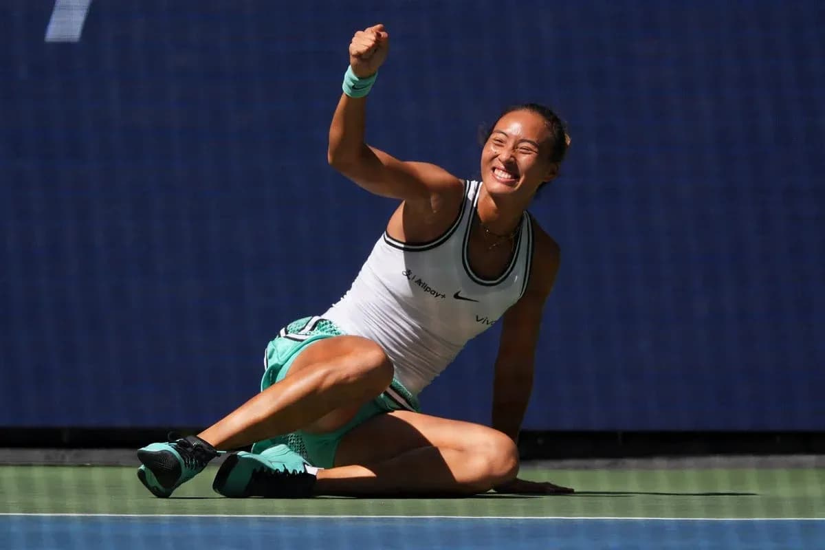 Tennis player celebrating on the court after winning Tennis player celebrating on the court after winning