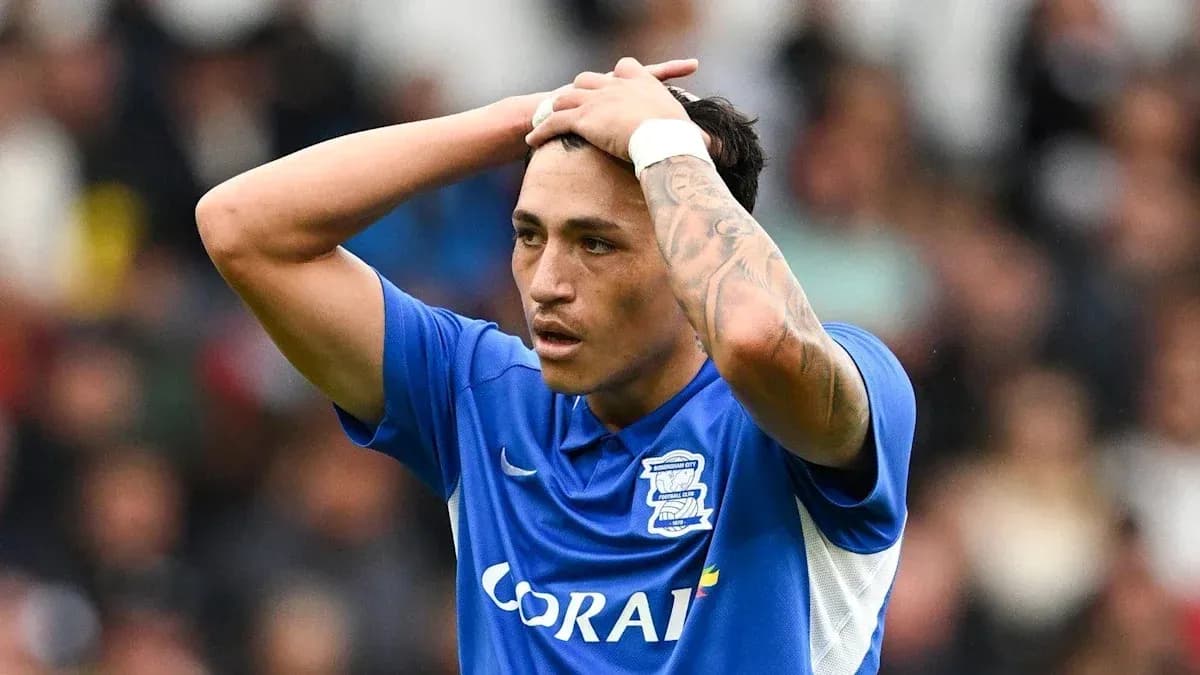 Player in blue jersey showing frustration on field Player in blue jersey showing frustration on field