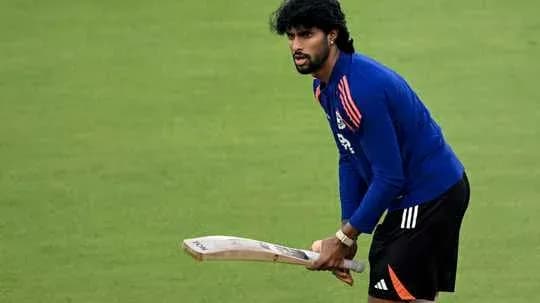 Player practicing with bat on cricket field Player practicing with bat on cricket field