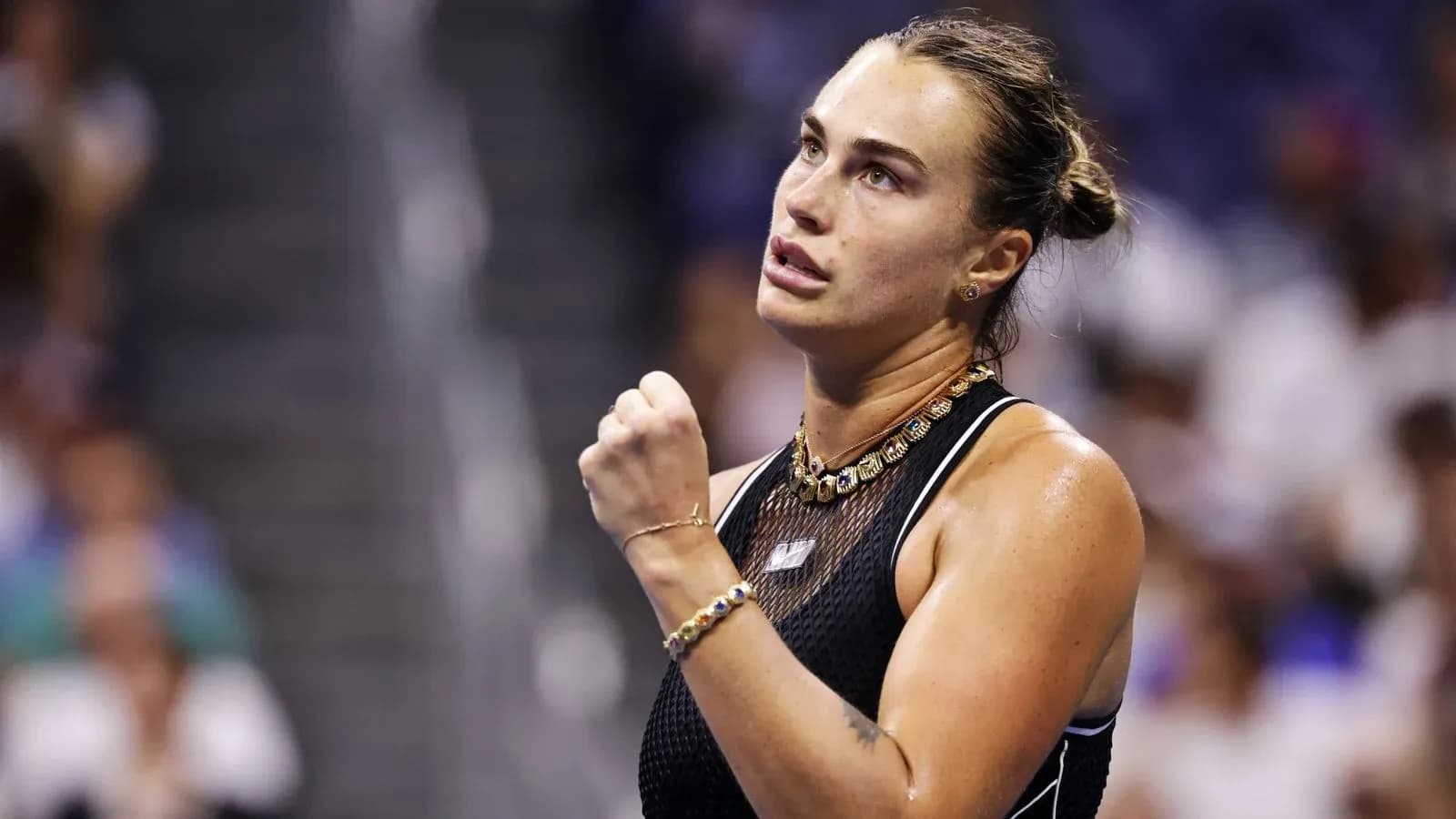 Tennis player celebrating during match at stadium Tennis player celebrating during match at stadium