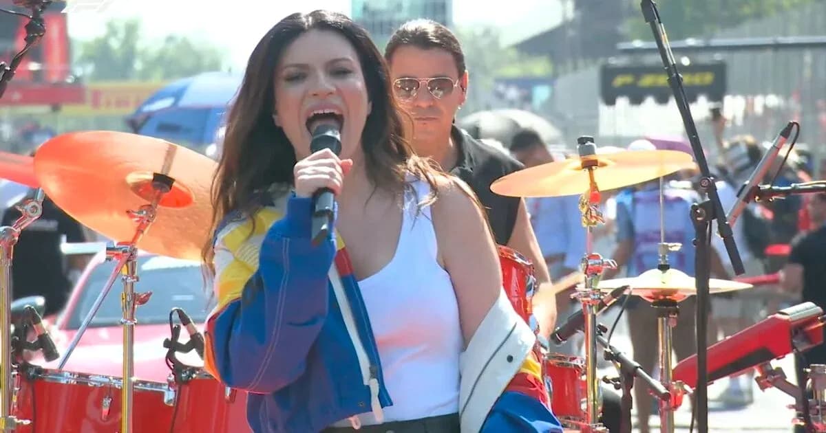 Singer performing on stage with a drummer Singer performing on stage with a drummer