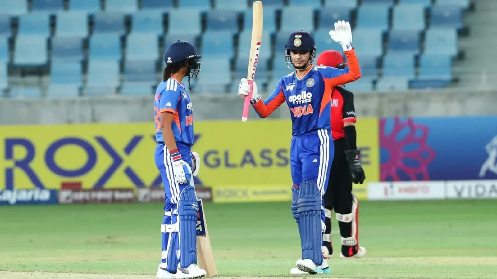 Batsman celebrating after scoring during cricket match Batsman celebrating after scoring during cricket match