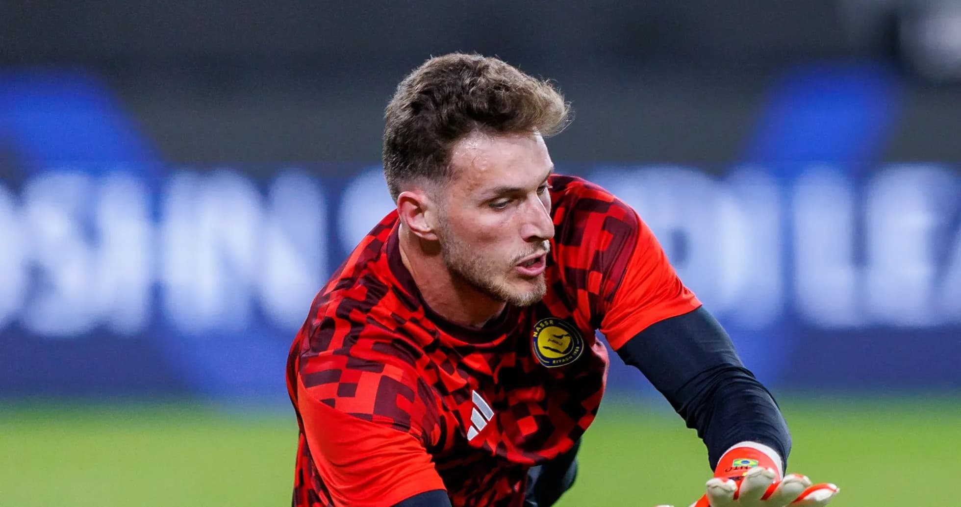 Goalkeeper training with gloves and red jersey Goalkeeper training with gloves and red jersey