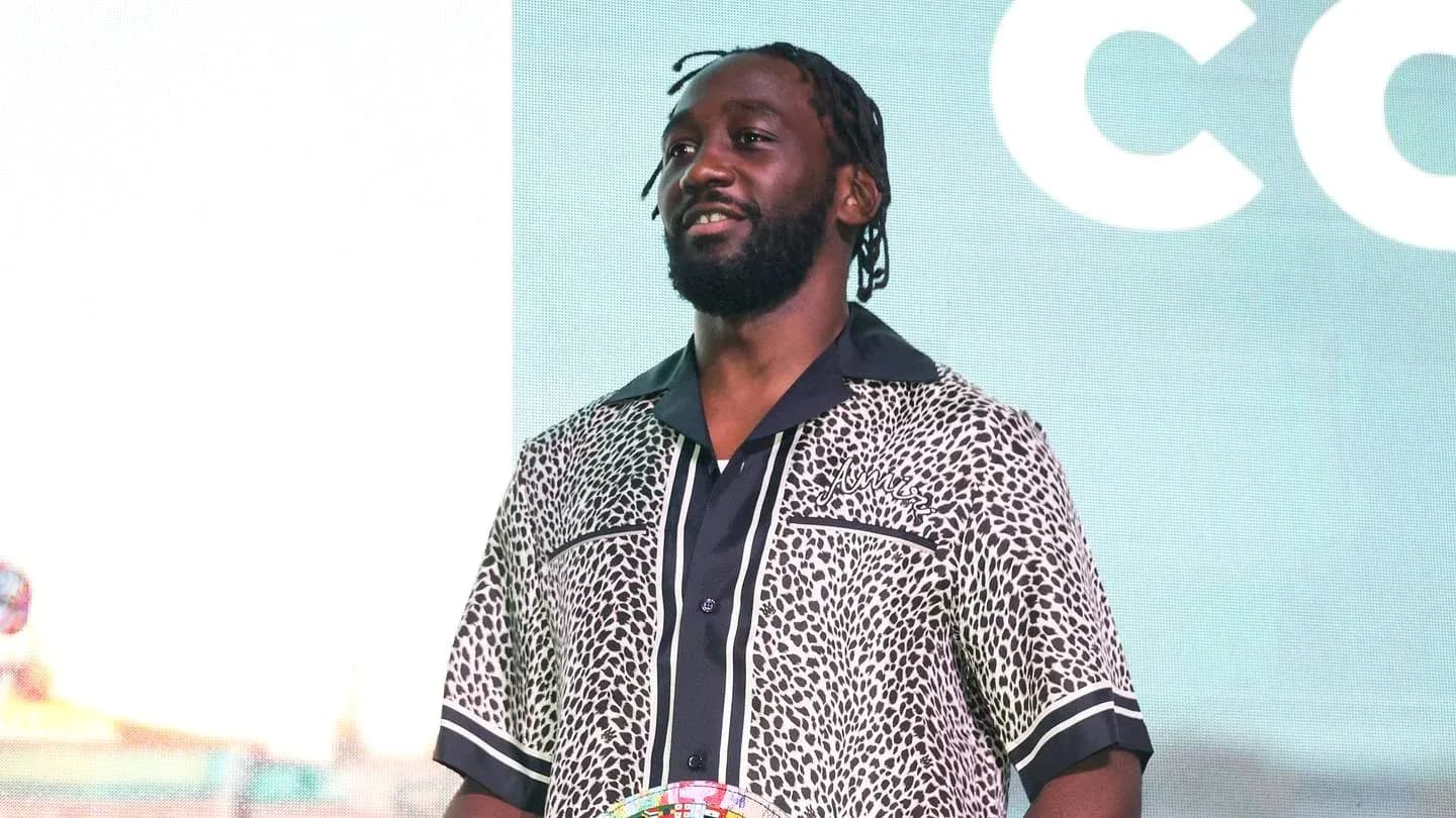 Man wearing patterned shirt at event stage Man wearing patterned shirt at event stage