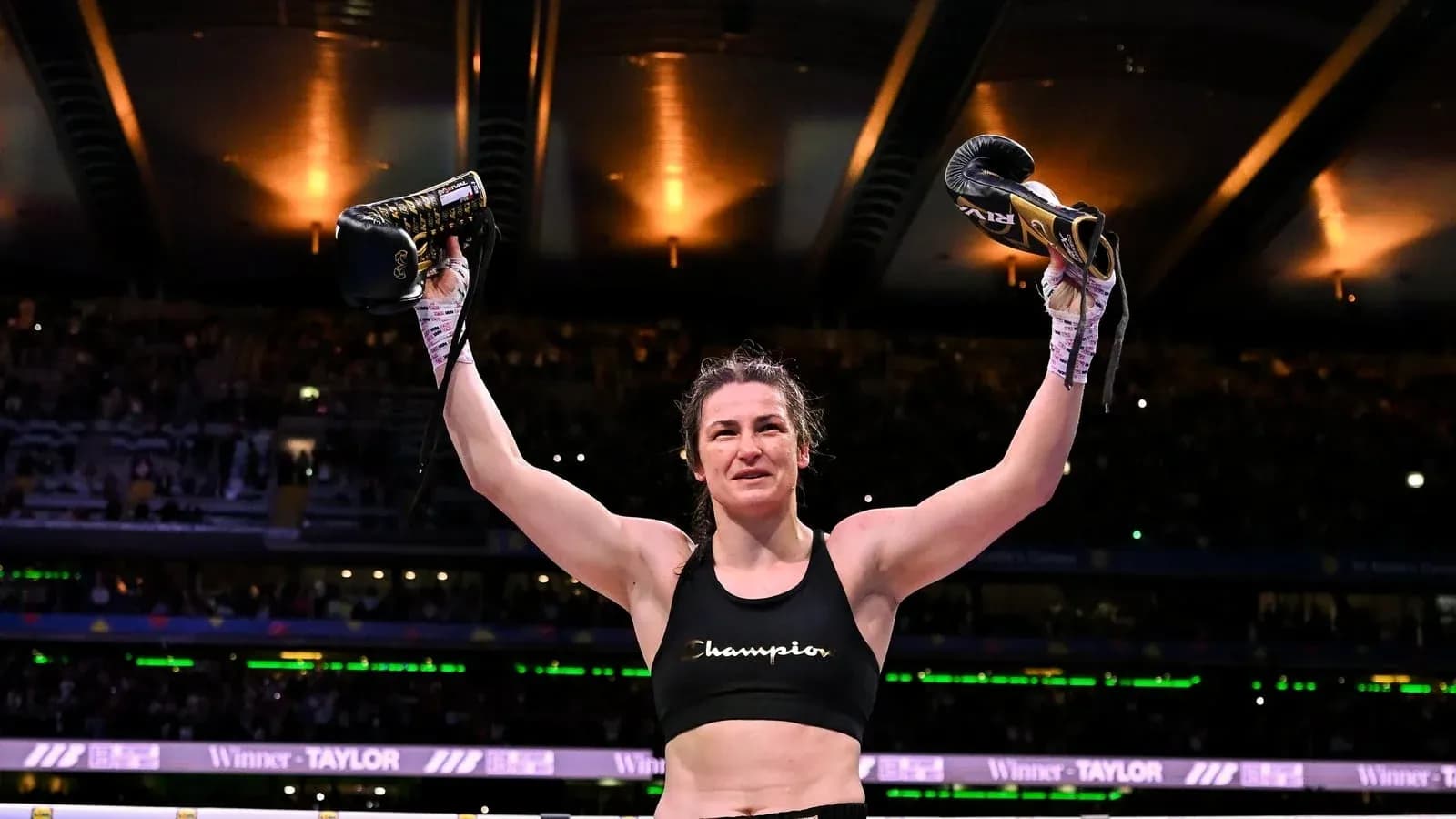 Boxer celebrating victory with gloves raised Boxer celebrating victory with gloves raised