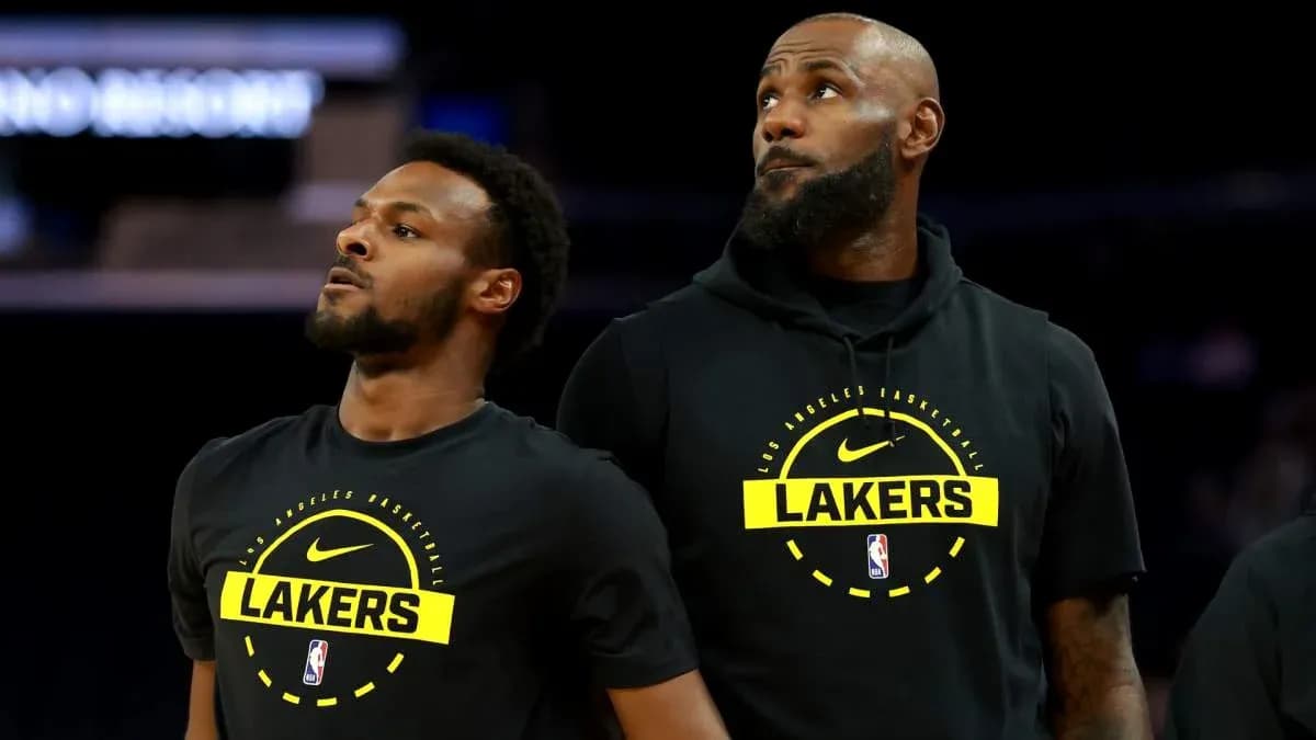 Two Lakers players in team hoodies during warm-up Two Lakers players in team hoodies during warm-up