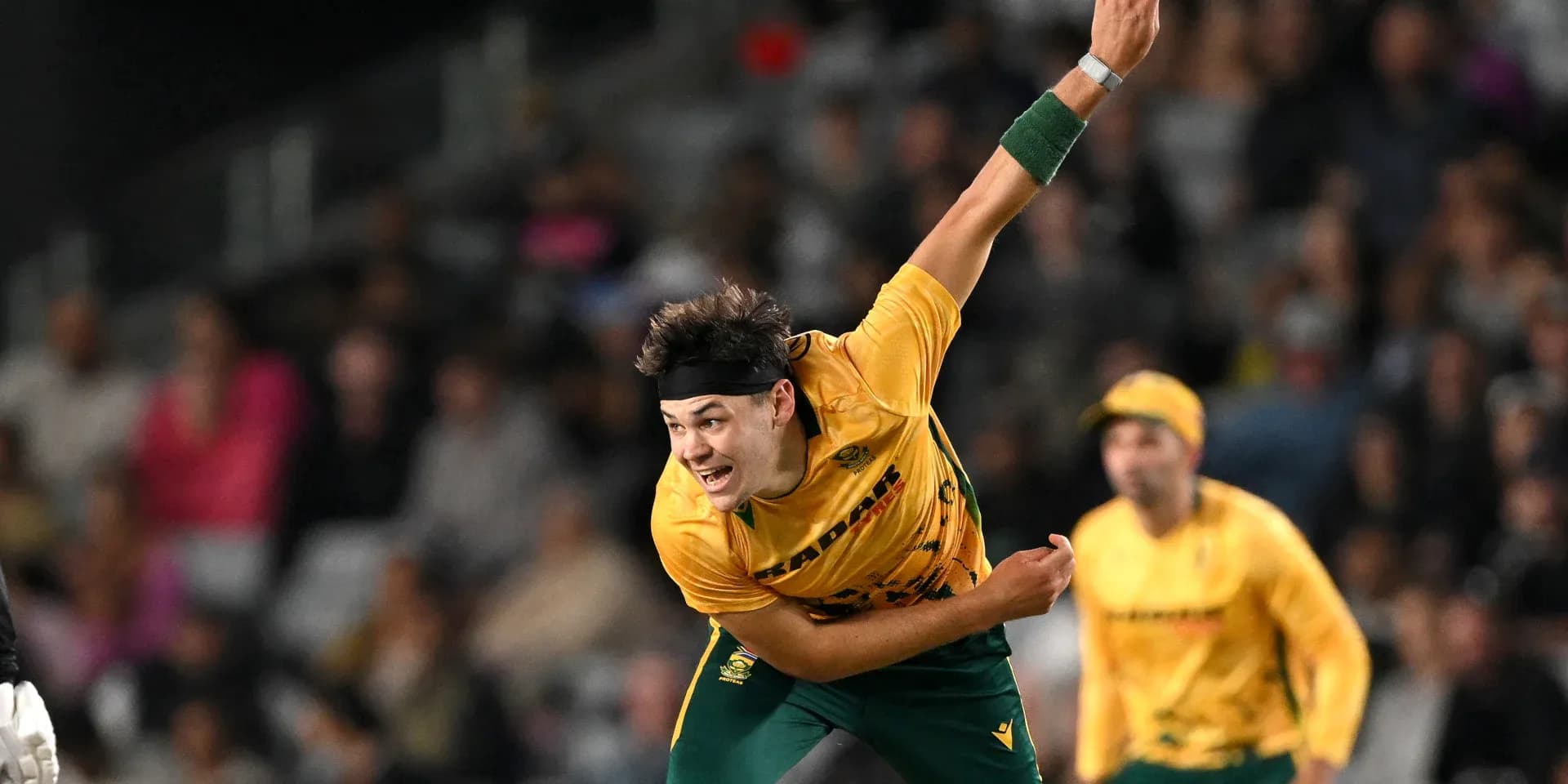 Bowler delivering a ball during cricket match Bowler delivering a ball during cricket match