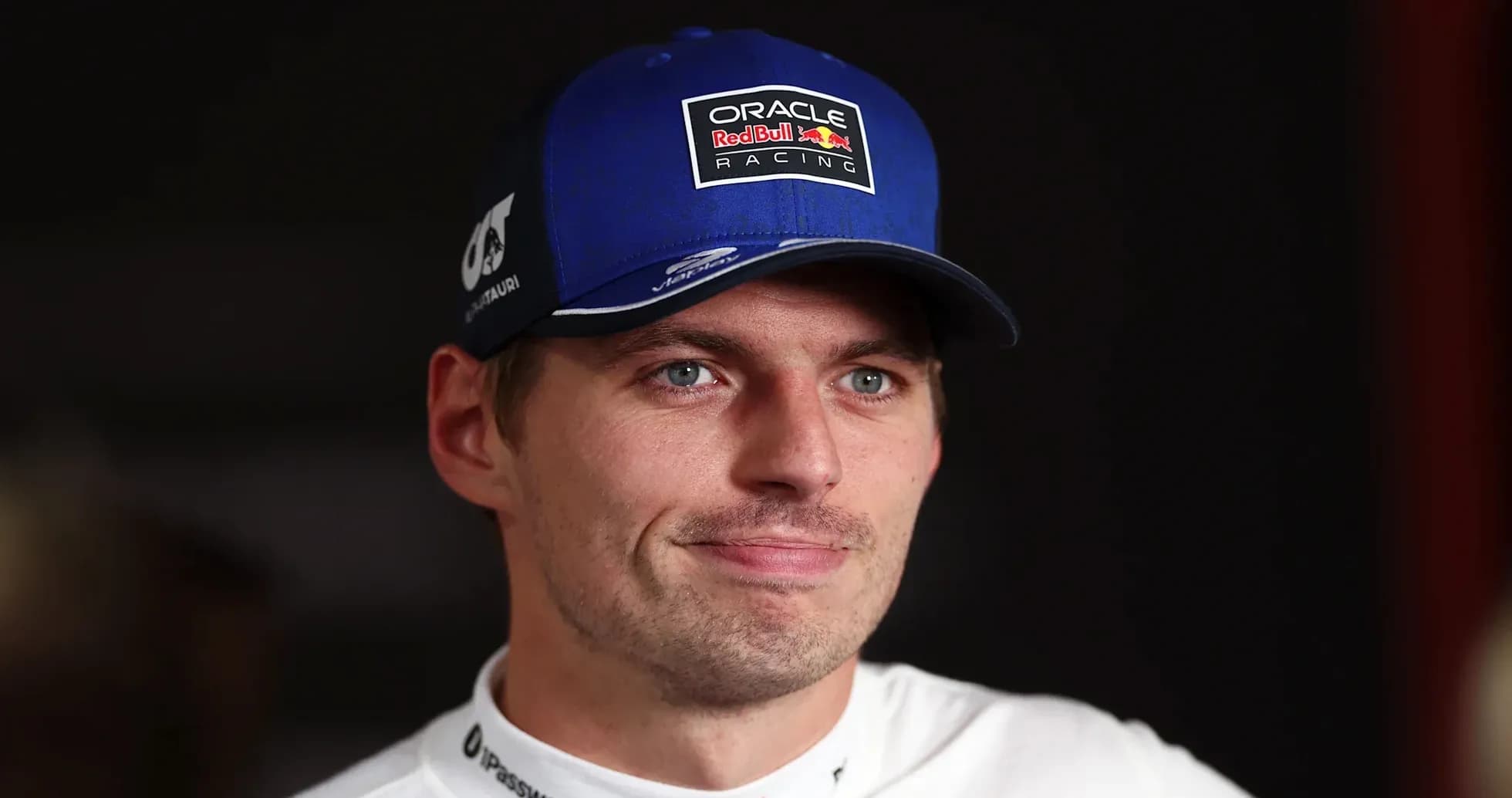 Racing driver wearing a blue cap during interview Racing driver wearing a blue cap during interview