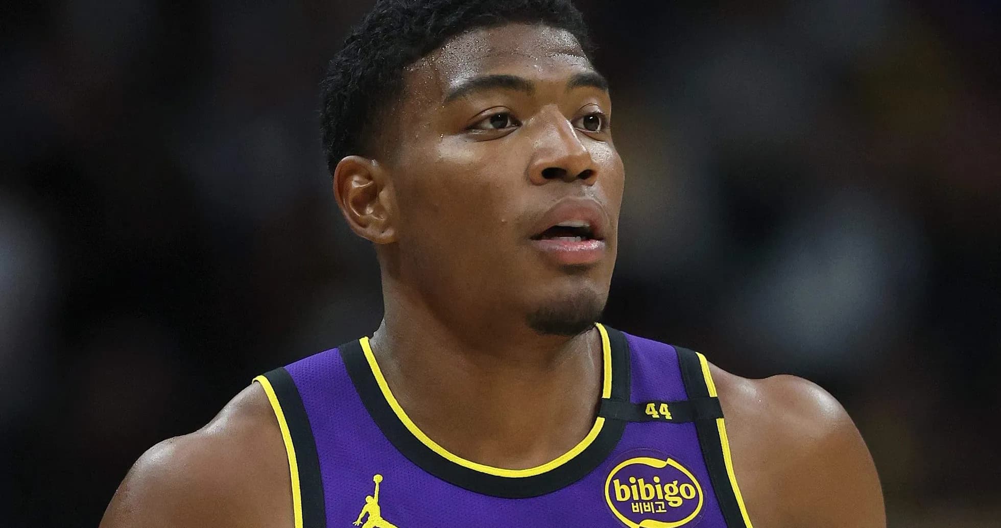 Player wearing Lakers jersey during game action Player wearing Lakers jersey during game action