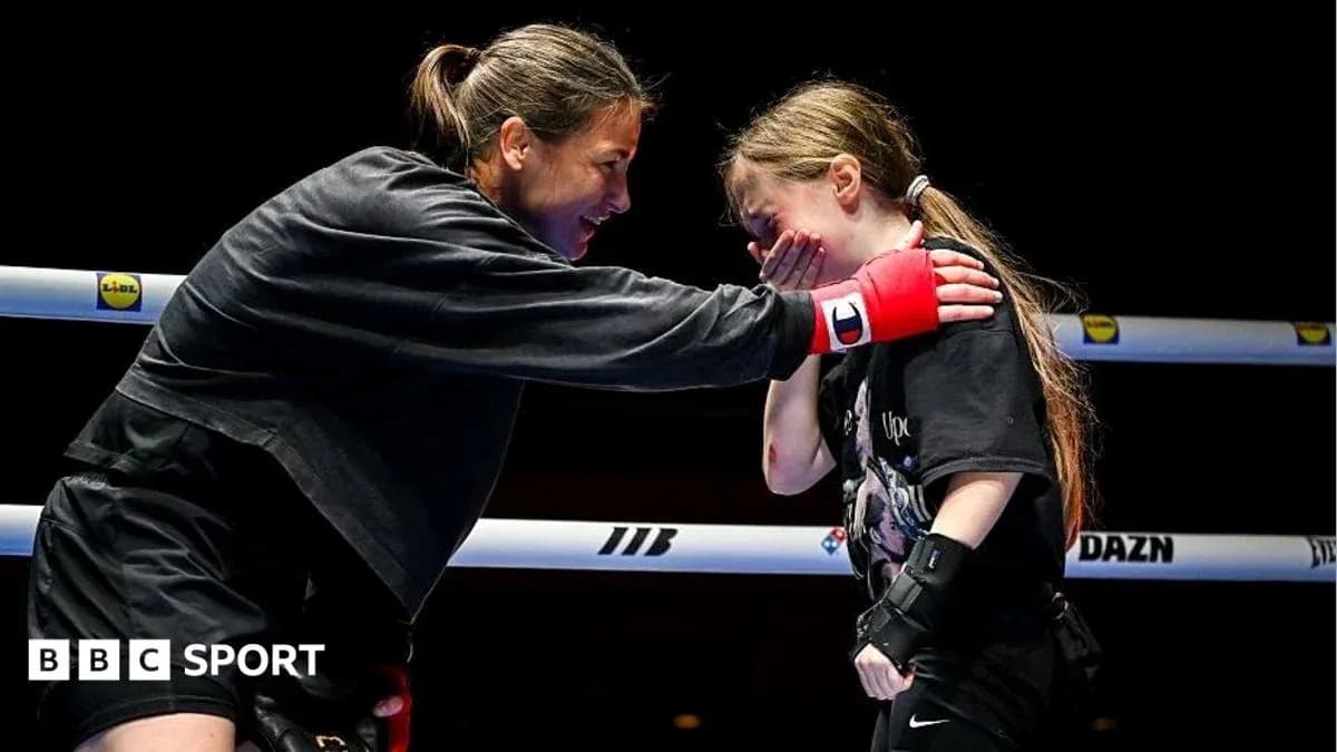 Boxer interacting with young girl in the ring Boxer interacting with young girl in the ring