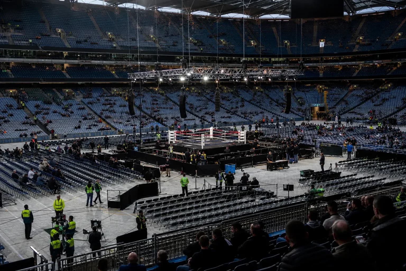 Boxing ring setup in large empty arena Boxing ring setup in large empty arena