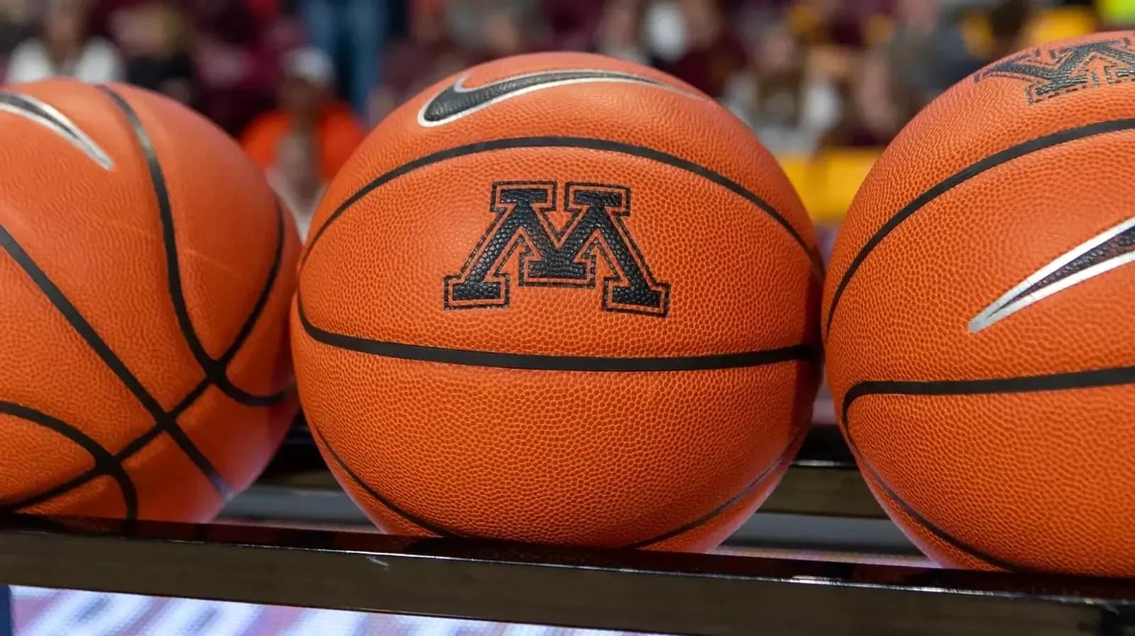 Basketballs with Minnesota logo on bench Basketballs with Minnesota logo on bench