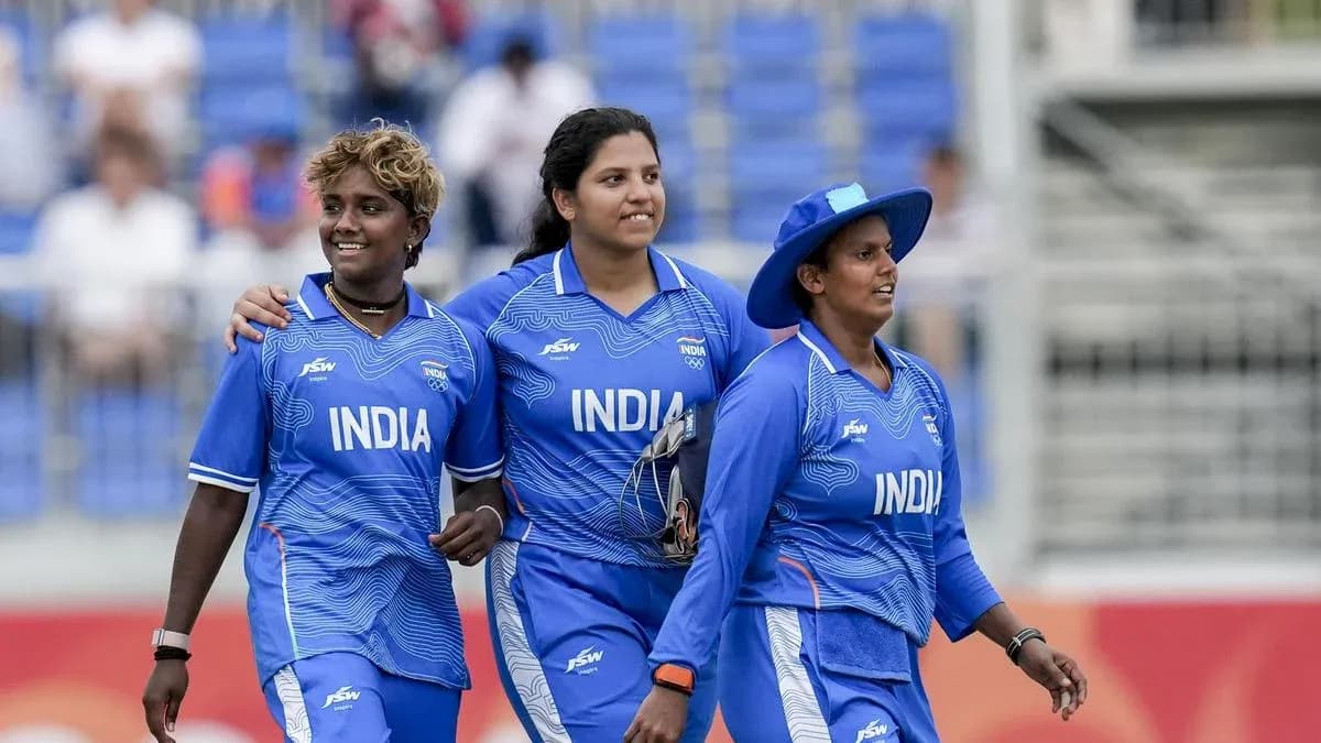 Three Indian female cricketers walking together Three Indian female cricketers walking together