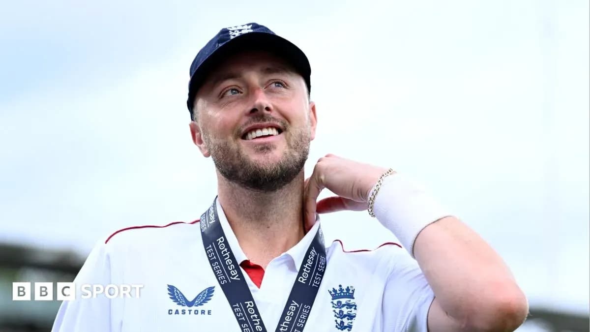 Cricketer wearing a medal, smiling at camera Cricketer wearing a medal, smiling at camera