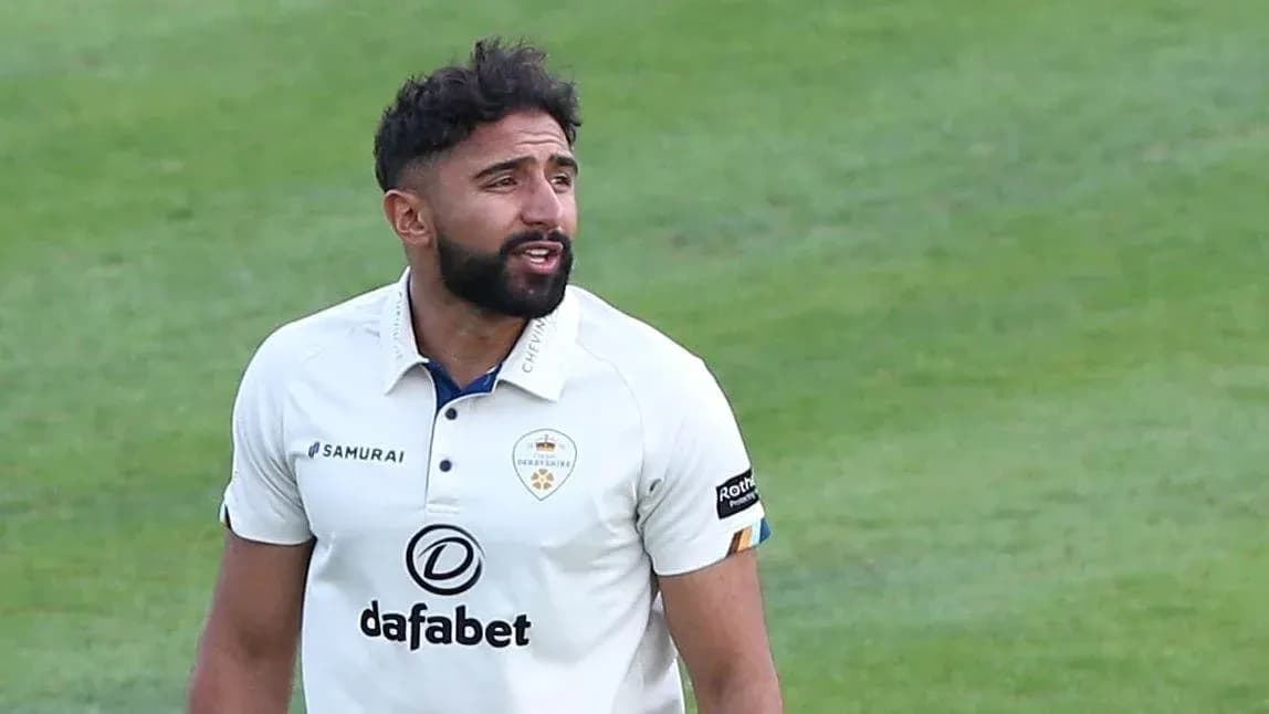 Cricketer wearing Derbyshire kit on field Cricketer wearing Derbyshire kit on field
