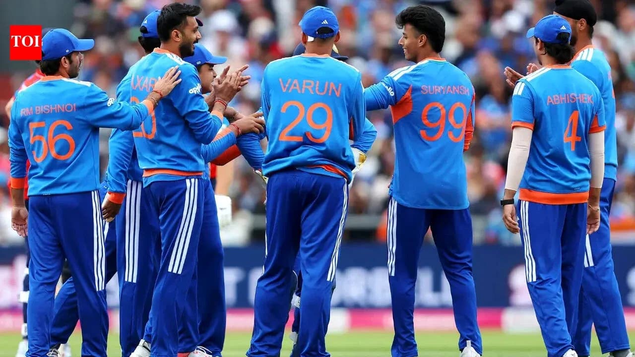 Cricket team celebrating a wicket on field Cricket team celebrating a wicket on field