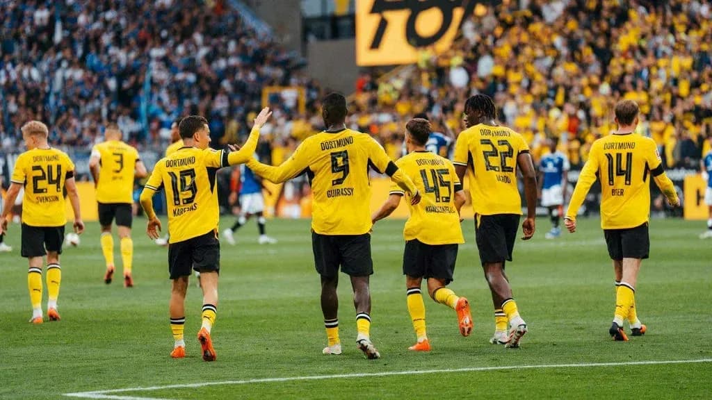 Borussia Dortmund players celebrating on the field Borussia Dortmund players celebrating on the field