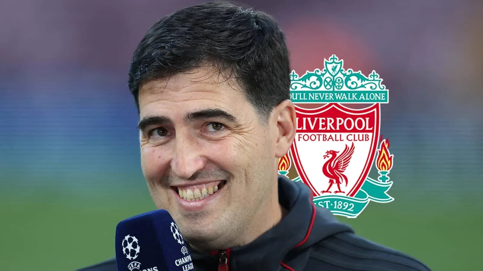 Man speaking into microphone with Liverpool logo behind Man speaking into microphone with Liverpool logo behind