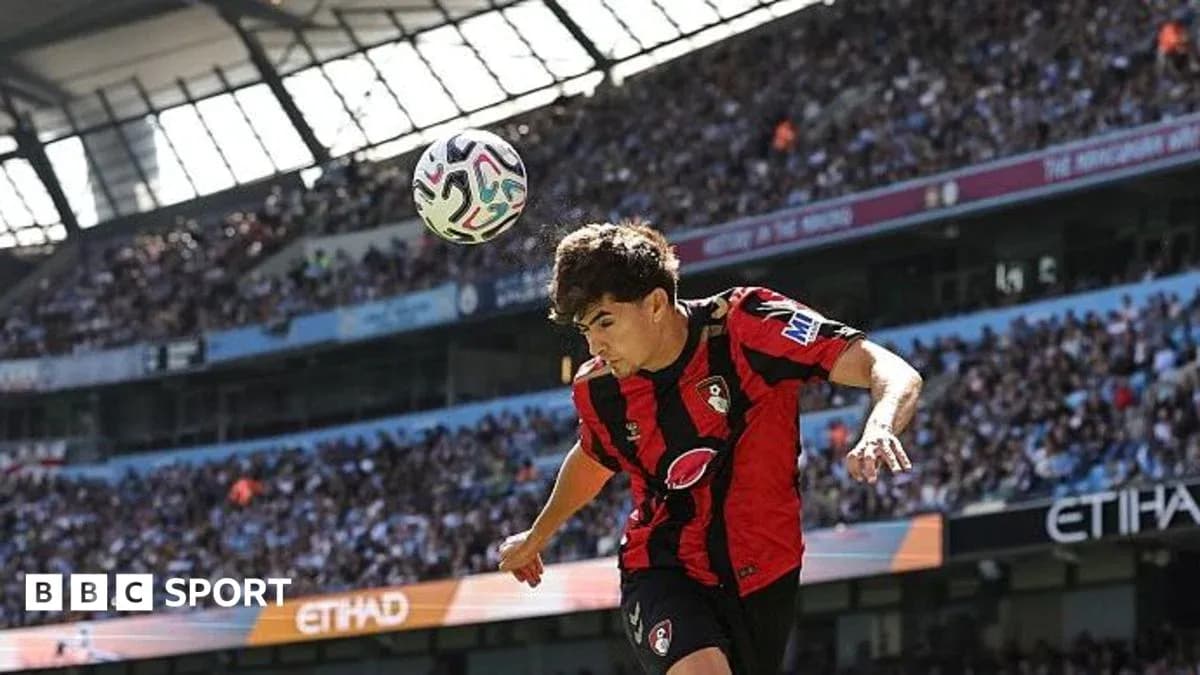 Bournemouth player heading ball during match Bournemouth player heading ball during match