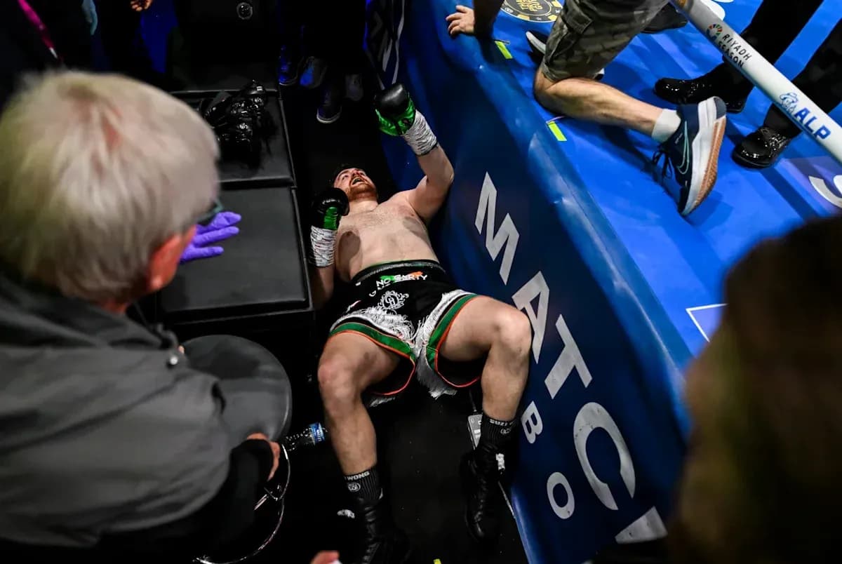 Boxer lying on the floor after match conclusion Boxer lying on the floor after match conclusion
