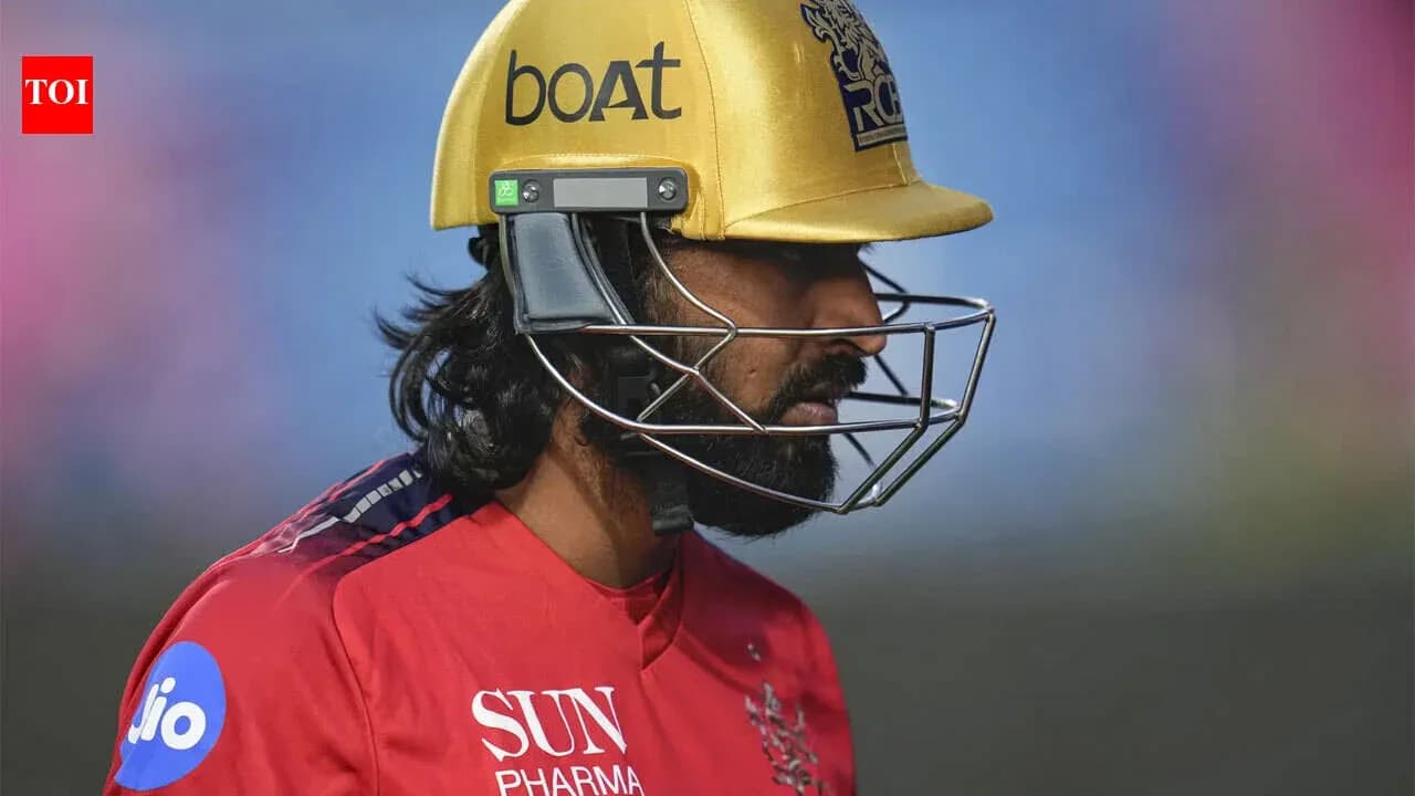 Cricketer wearing a golden helmet during match Cricketer wearing a golden helmet during match